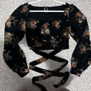 Flowy floral bell sleeve crop top with cross cross detail